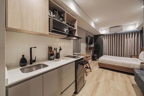 Microwave, stovetop, coffee/tea maker, cookware/dishes/utensils