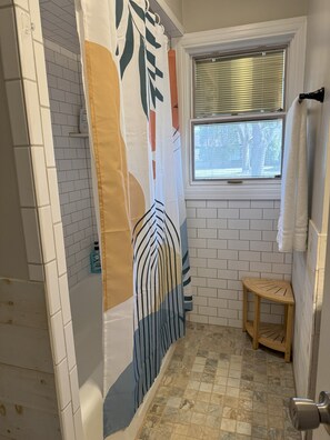 Shower, towels, soap, toilet paper