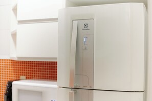 A white Electrolux refrigerator with a control panel displaying temperature settings. - SUH Ipanema 03 Cozy Beach (Rio de Janeiro)