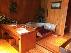 Jetted bath, hair dryer, soap, toilet paper