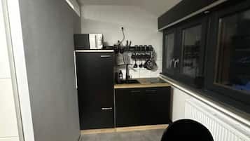 Fridge, microwave, stovetop, coffee/tea maker