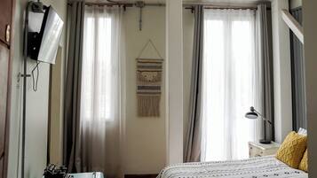 Family Quadruple Room, Balcony, City View | Down comforters, individually decorated, individually furnished