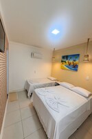 Triple Room | Minibar, blackout drapes, free WiFi, bed sheets