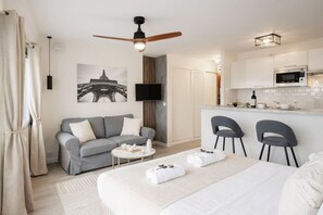 Deluxe Studio, City View | Living area | 80-cm Smart TV with digital channels