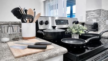 Coffee/tea maker, fridge, microwave, oven