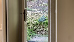 An open door leading to a stone staircase with a view of a garden. - Michelangelo at our 'Clos Lussault' near Amboise in the Loire Valley (Lussault-sur-Loire)