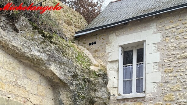 A stone building with a wooden door and a window. - Michelangelo at our 'Clos Lussault' near Amboise in the Loire Valley (Lussault-sur-Loire)