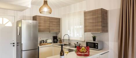 Microwave, coffee/tea maker, cookware/dishes/utensils