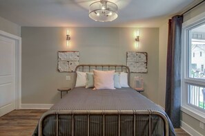 1 bedroom, desk, iron/ironing board, travel crib