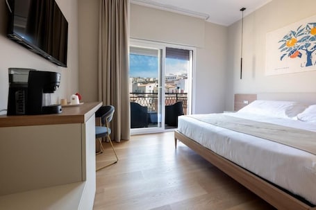 Family Room, Balcony, City View | In-room safe, blackout drapes, soundproofing, free WiFi