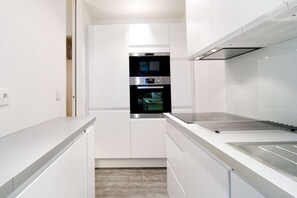 Fridge, coffee/tea maker, toaster, cookware/dishes/utensils