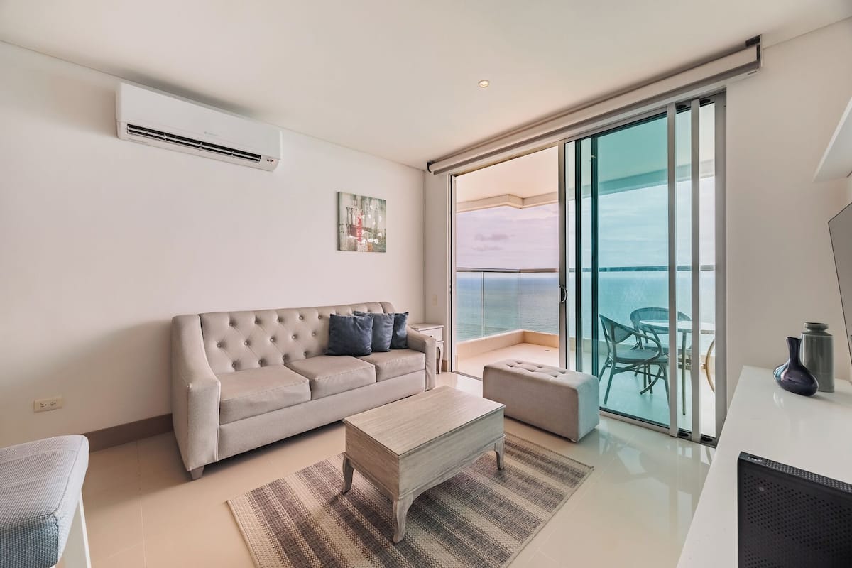 Premium Apartment, Balcony, Beach View | Living area | 50-inch Smart TV with digital channels