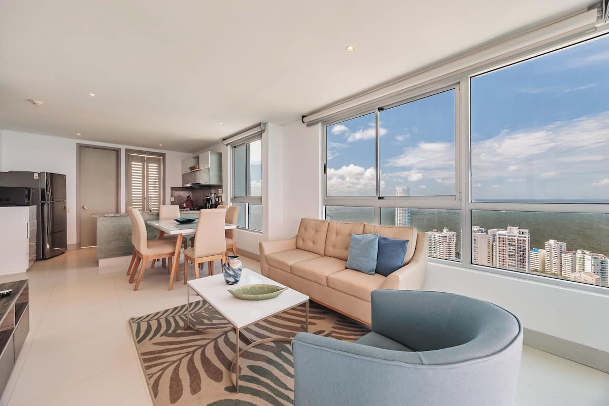 Grand Apartment, Balcony, Beach View | Living area | 50-inch Smart TV with digital channels