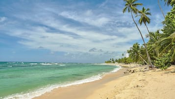 On the beach, sun loungers, beach towels