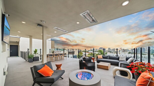 A rooftop lounge with modern furniture, a fire pit, and a cityscape view. - King Bed & Rooftop Views Prime Bankers Hill near Balboa Park (San Diego)