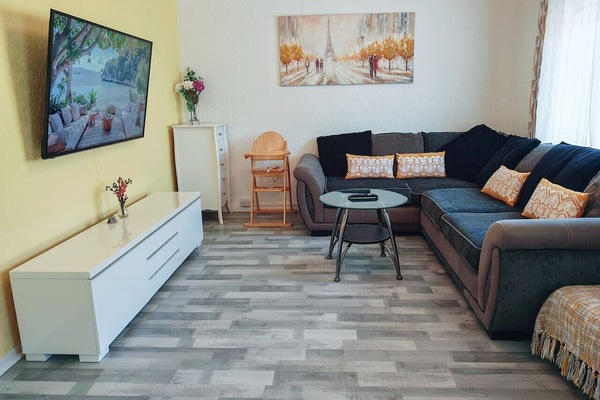 Spacious lounge with smart TV and corner sofa