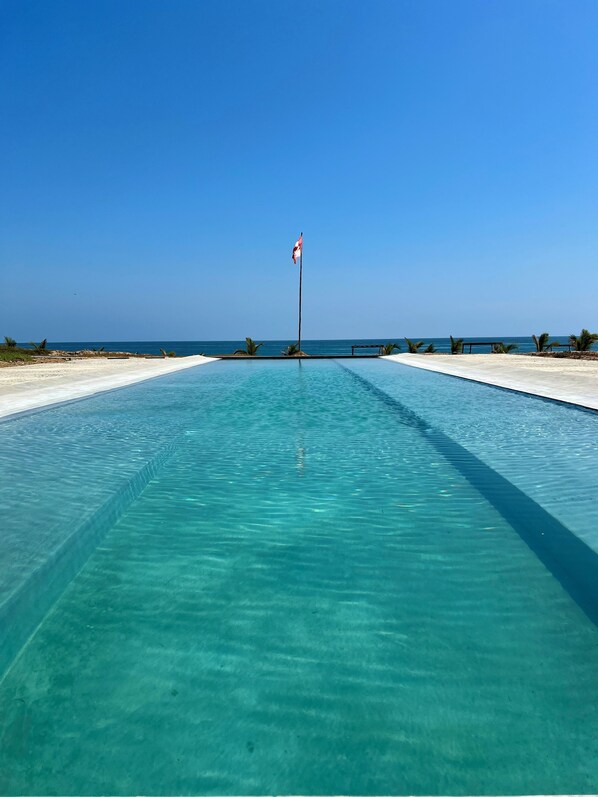 Outdoor pool, pool umbrellas, sun loungers