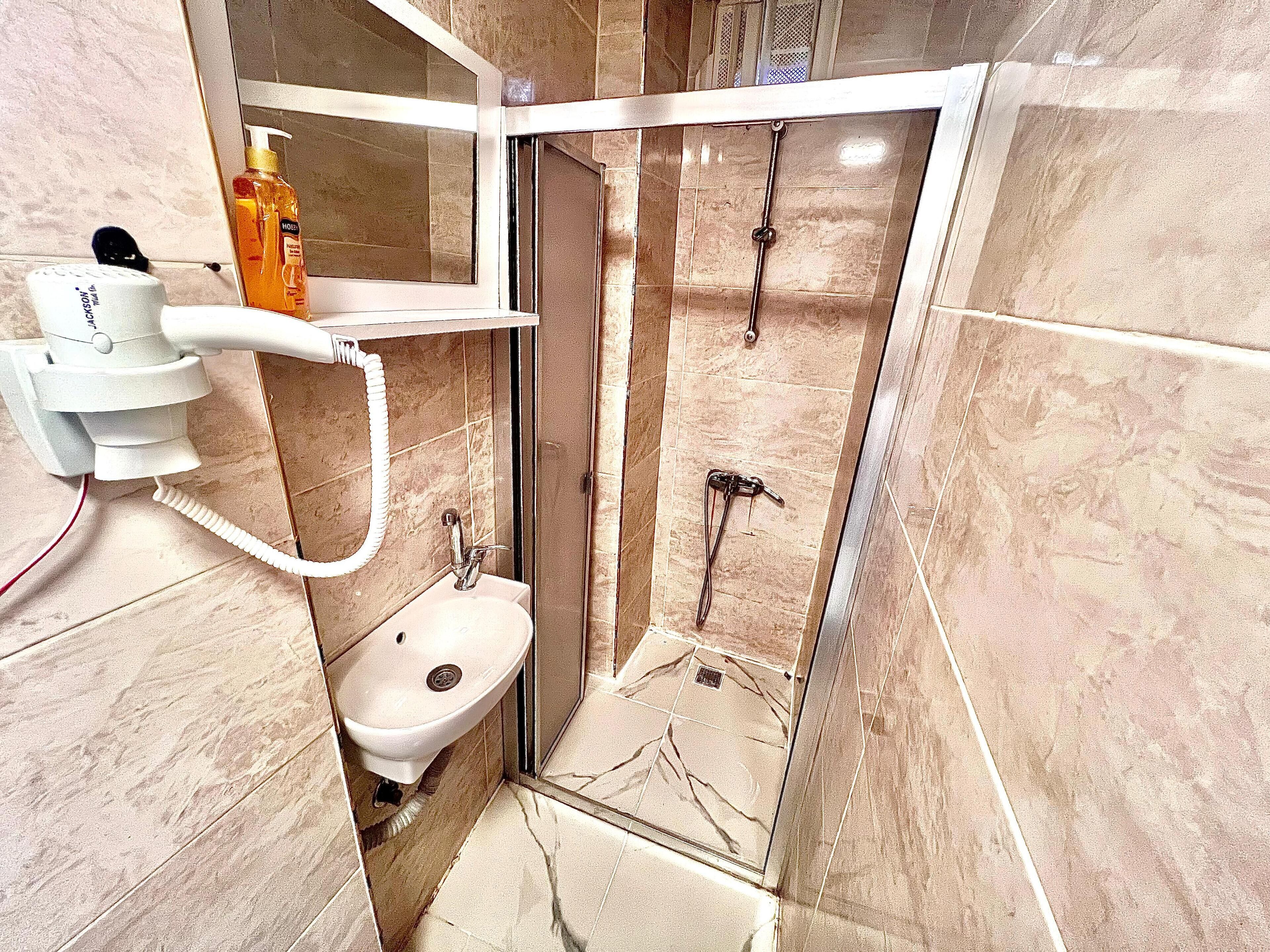 Classic Studio | Bathroom | Shower, hair dryer, slippers, towels