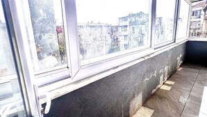 A corner of a room with a window overlooking a cityscape. - Taksim The Capital Center Hotel (Istanbul)