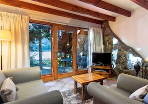 Superior Apartment, Lake View | Living area | 32-inch flat-screen TV with cable channels, DVD player, table tennis
