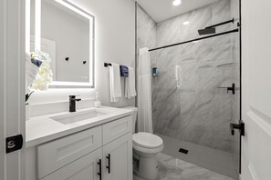 Shower, hair dryer, towels, soap