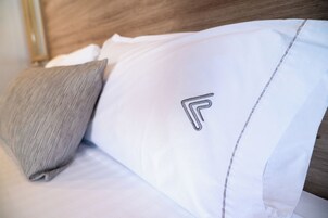 Premium bedding, down comforters, in-room safe, laptop workspace