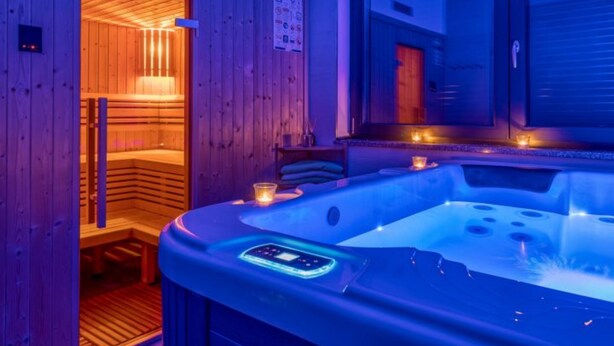 A sauna room with a wooden interior and a large window. - Holiday Home Mali Raj (Josipdol)