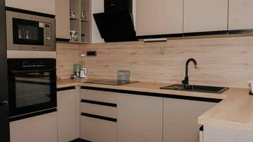 House (Three Bedroom Holiday Home with Sauna) | Private kitchen | Fridge