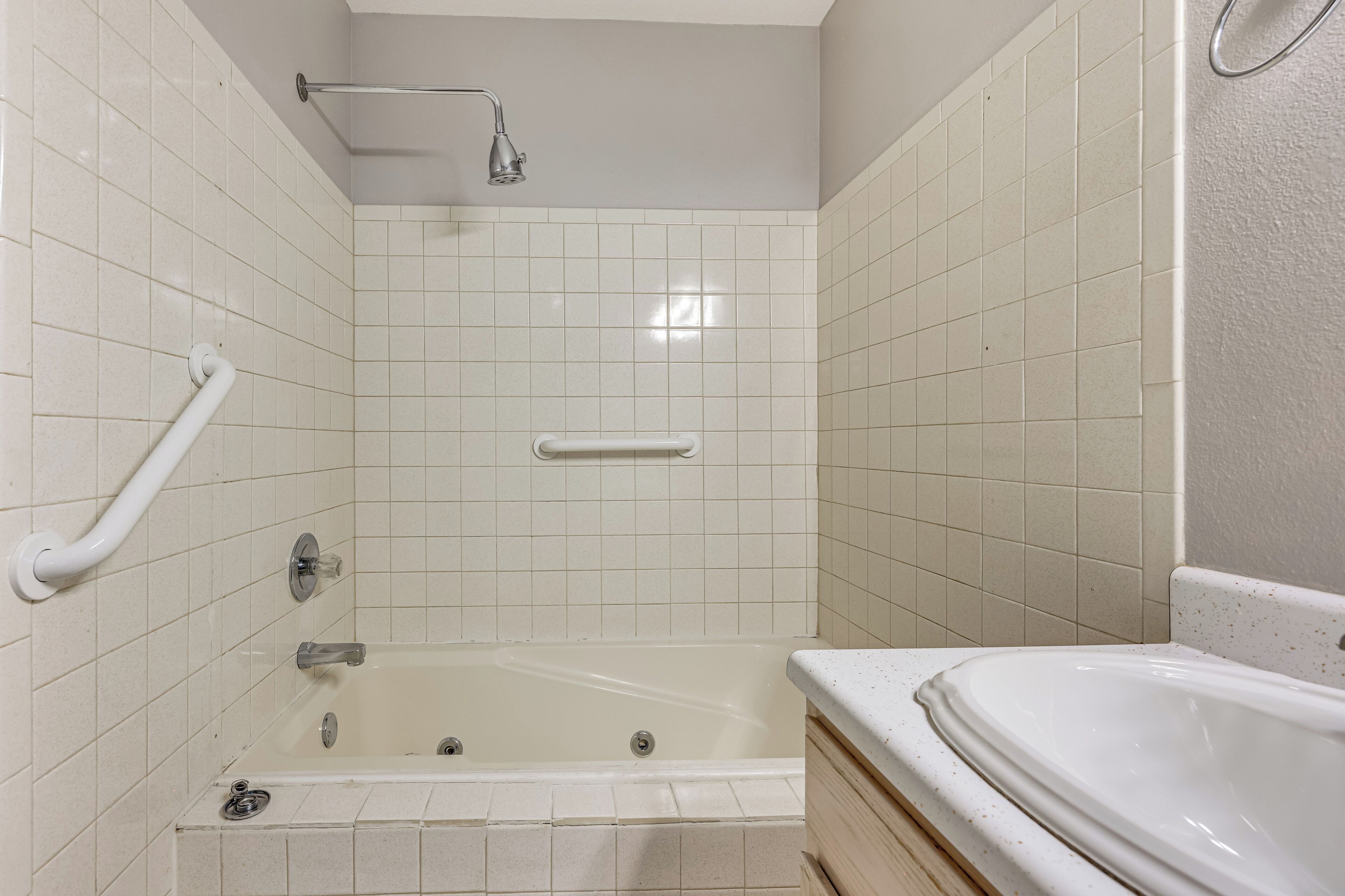 A bathroom with a bathtub, a shower, and a toilet.
