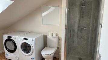 Shower, hair dryer, towels, soap