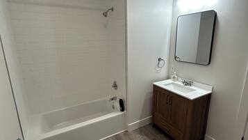 Shower, towels, soap, toilet paper