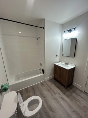 Shower, towels, soap, toilet paper