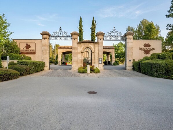A gated entrance with a sign for 'European Tour Destination' and 'Terre Blanche.'