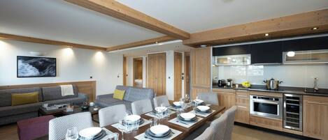A modern kitchen with wooden cabinets and a built-in oven.