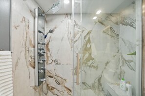 Shower, hair dryer, towels, soap