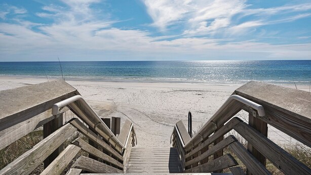 A wooden staircase leading to a sandy beach with a clear view of the ocean. - Charming Beach Cottage, 2 Pools and Tennis Access + Free Attraction Tickets! (Santa Rosa Beach)