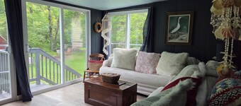 Charming 3-bedroom house on a secluded 11 acres of wooded trails and riverfront.