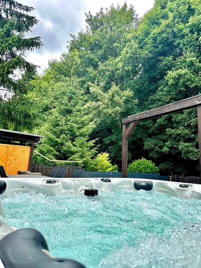 House by the forest with outdoor whirlpool and fireplace