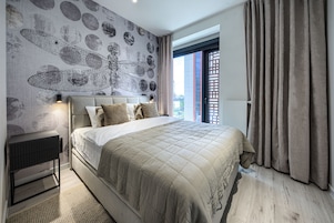 Deluxe Apartment, City View | Laptop workspace, blackout drapes, soundproofing, iron/ironing board