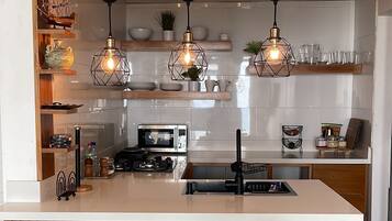 Fridge, microwave, stovetop, coffee/tea maker