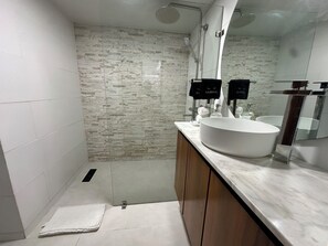 Shower, hair dryer, towels, toilet paper