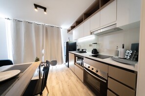 Apartment | Private kitchen | Full-size fridge, microwave, oven, stovetop