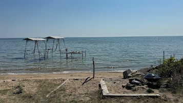 On the beach, sun loungers, beach towels