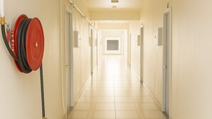 A long, narrow hallway with a tiled floor and doors on both sides. - 1-bedroom Studio aprtmt with AC, WiFi, Washer,Dryer located 5min Apia, on mainrd (Apia)