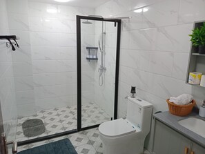 Shower, hair dryer, towels, soap