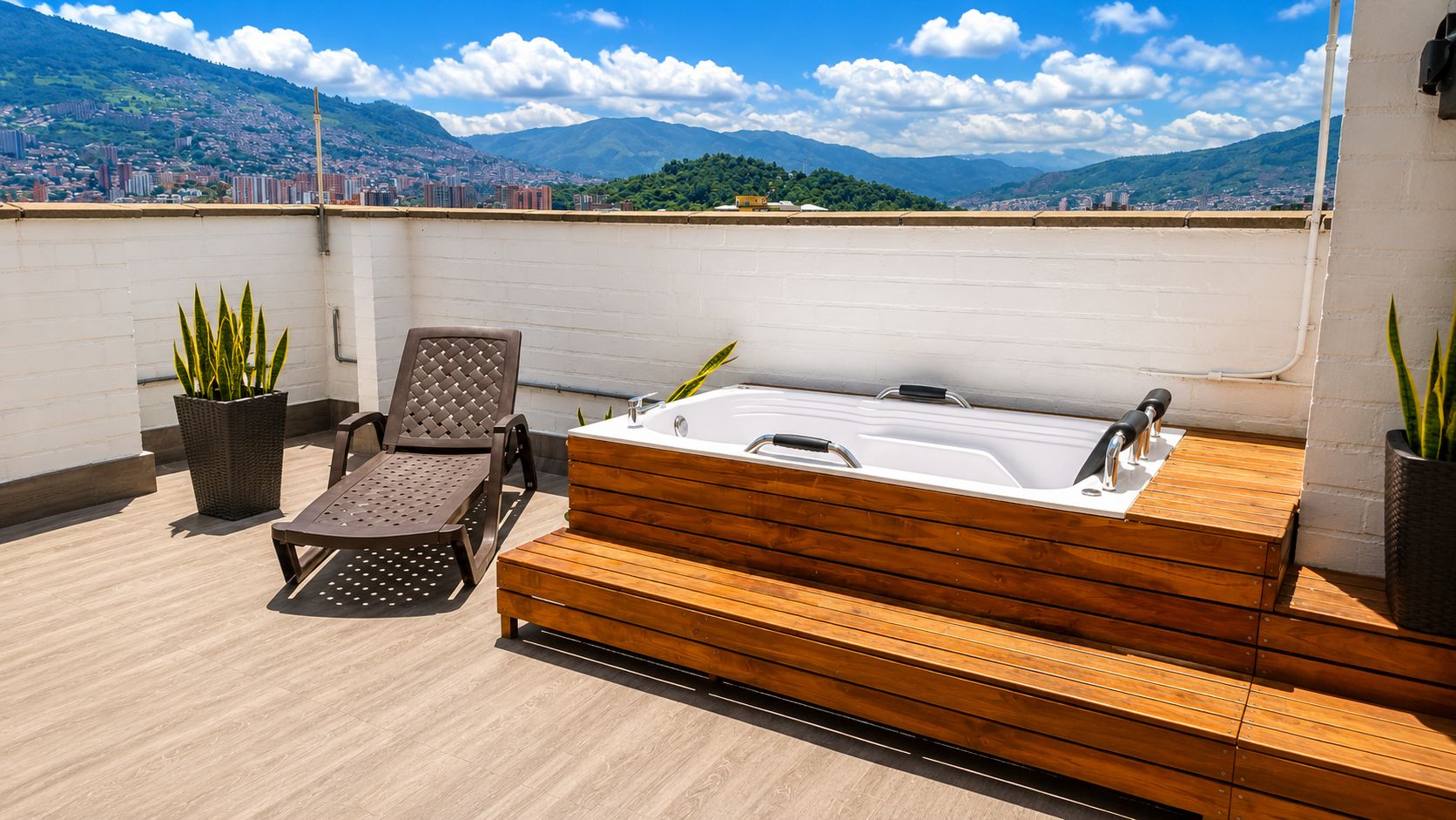 A rooftop terrace with a wooden deck, a hot tub, and two lounge chairs.