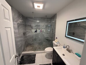 Shower, hair dryer, towels, soap