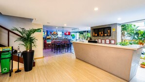A sports bar with a counter, bar stools, and a view of the outdoors. - apartament with the best views  (Medellín)