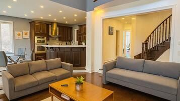 Smart TV, fireplace, books, offices