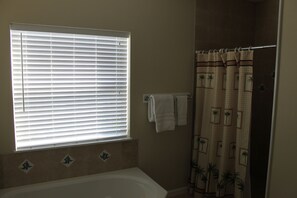 Shower, jetted tub, towels